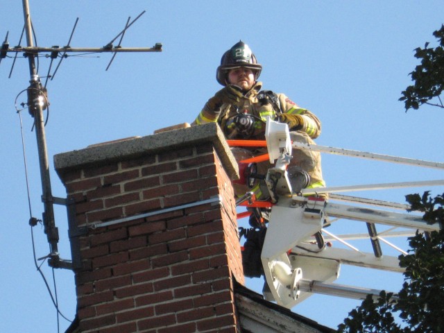 Firefighter Mike Hallman working a chimney fire in East Nottingham.